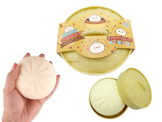 Viral Jumbo Kawaii Dumpling Squishy in a white plastic steamer basket, slow-rising silicone stress ball for anxiety relief and desk zen.”